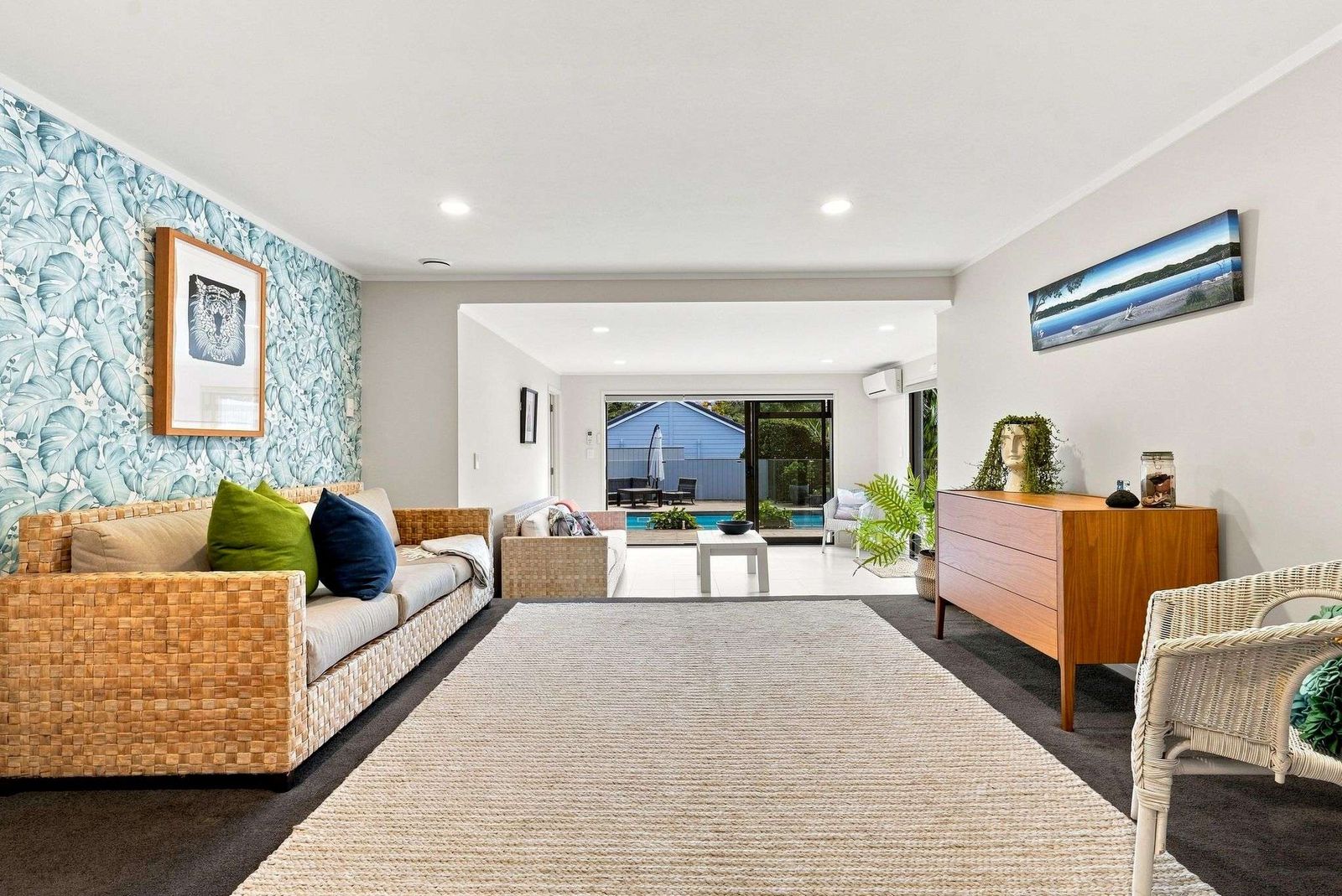 Beach Road, Campbells Bay - lounge styled against a feature wallpaper wall