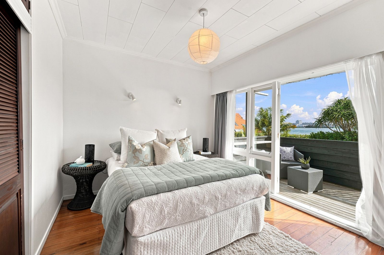 Hurstmere Road, Takapuna - bedroom styled with garden outlook