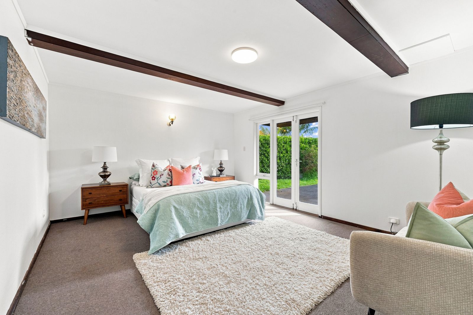 Hurstmere Road, Takapuna - bedroom styled beneath exposed beams