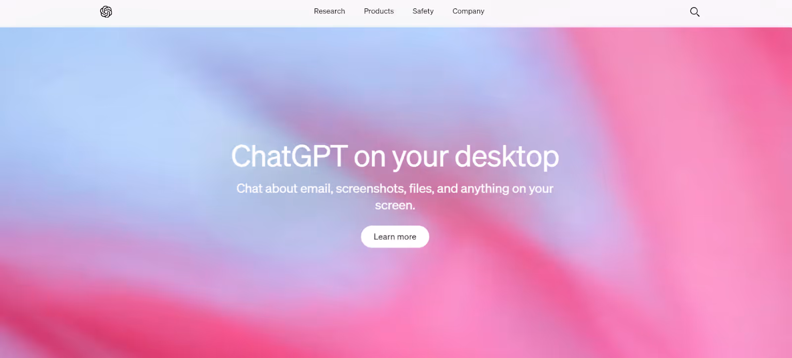 A webpage shows a blurred pink and blue background with center text: "ChatGPT on your desktop. Chat about email, screenshots, files, and anything on your screen." Below this text, there's a "Learn more" button. The top menu options read: Research, Products, Safety, Company.