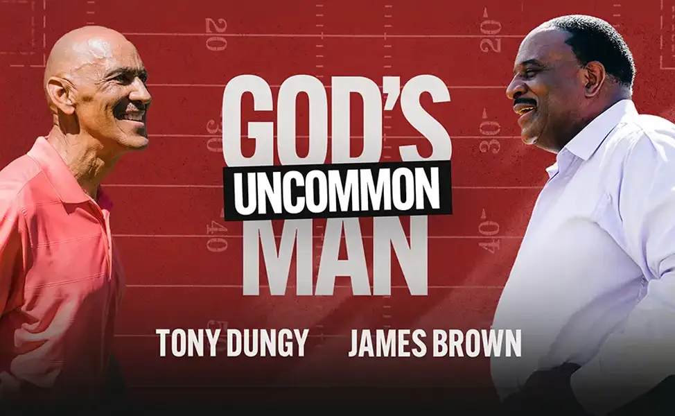Tony Dungy and James Brown face each other with 'God's Uncommon Man' text on red background.