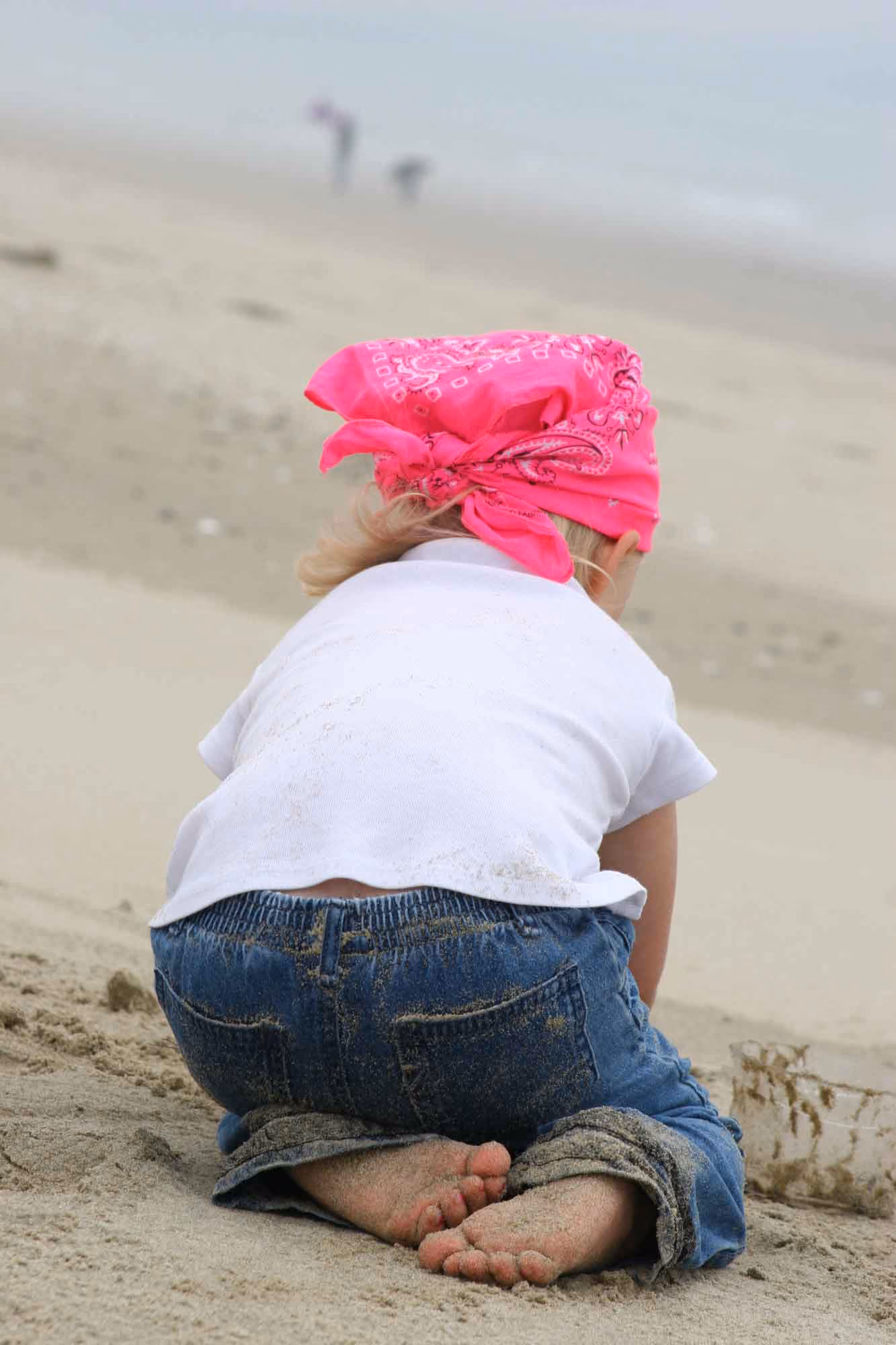 Child playing in sand