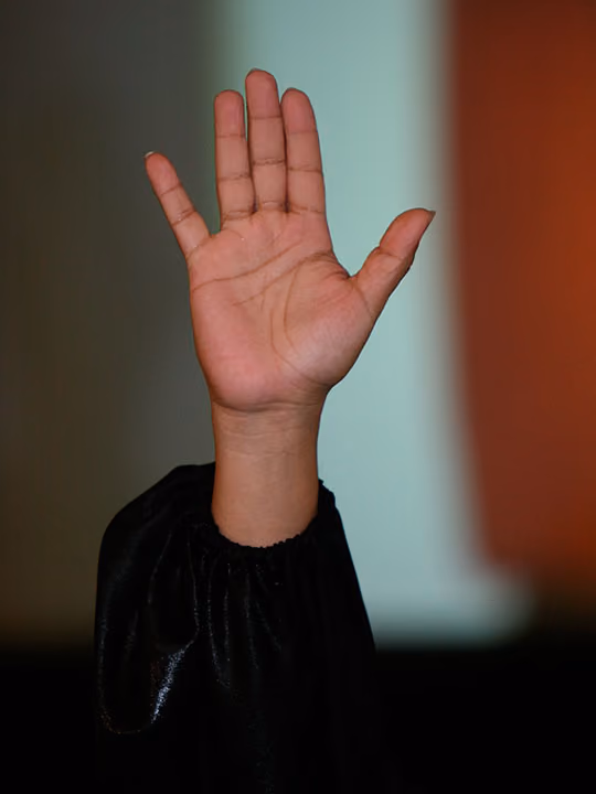 Hand raised to baptize