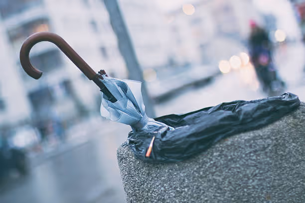 Umbrella in trash can