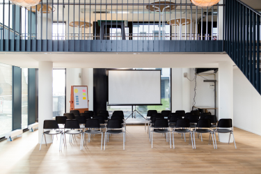 [background image] image of stage with seating for author & writer