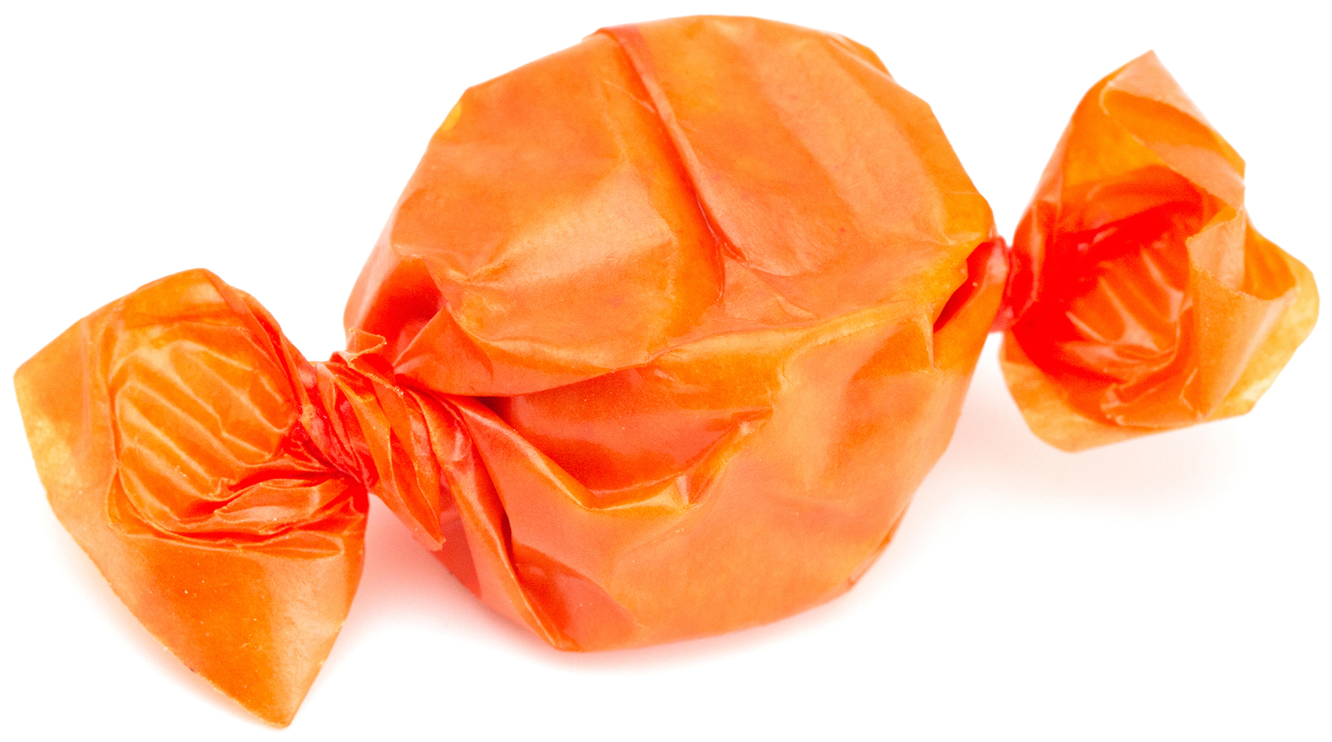 A candy wrapped in orange wax paper