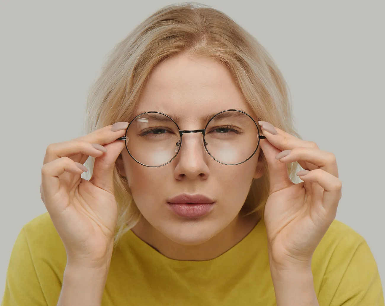Lady wearing Eyedeal vision glasses