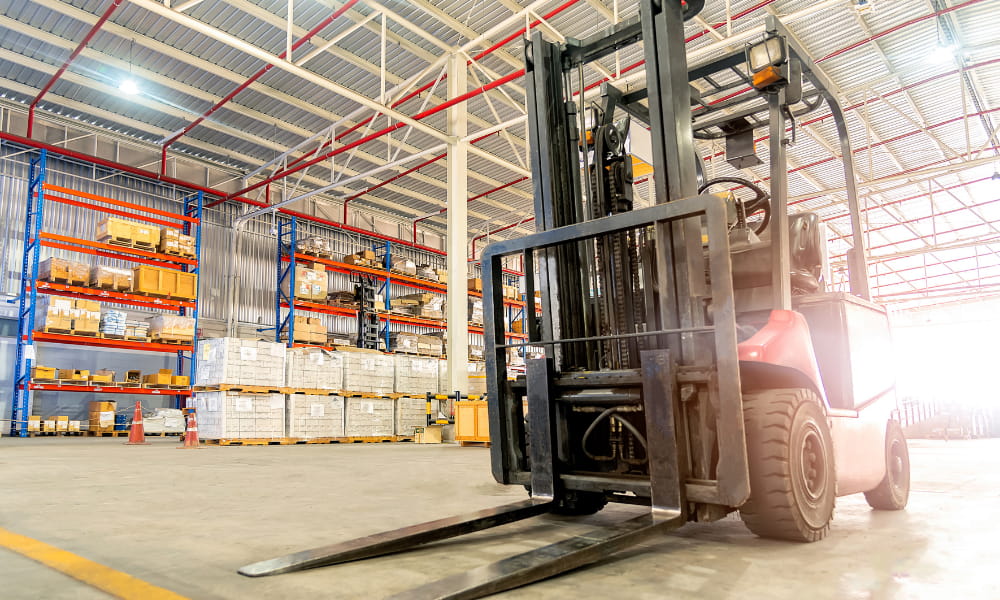 A forklift driver in a warehouse