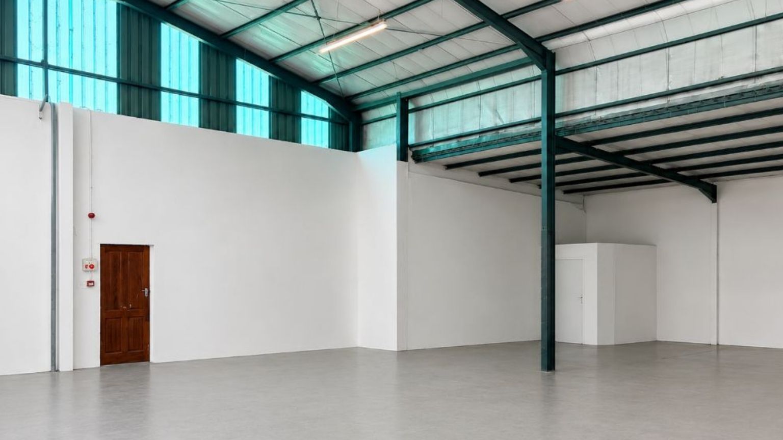 Secure warehouse with roller shutter door and truck access 