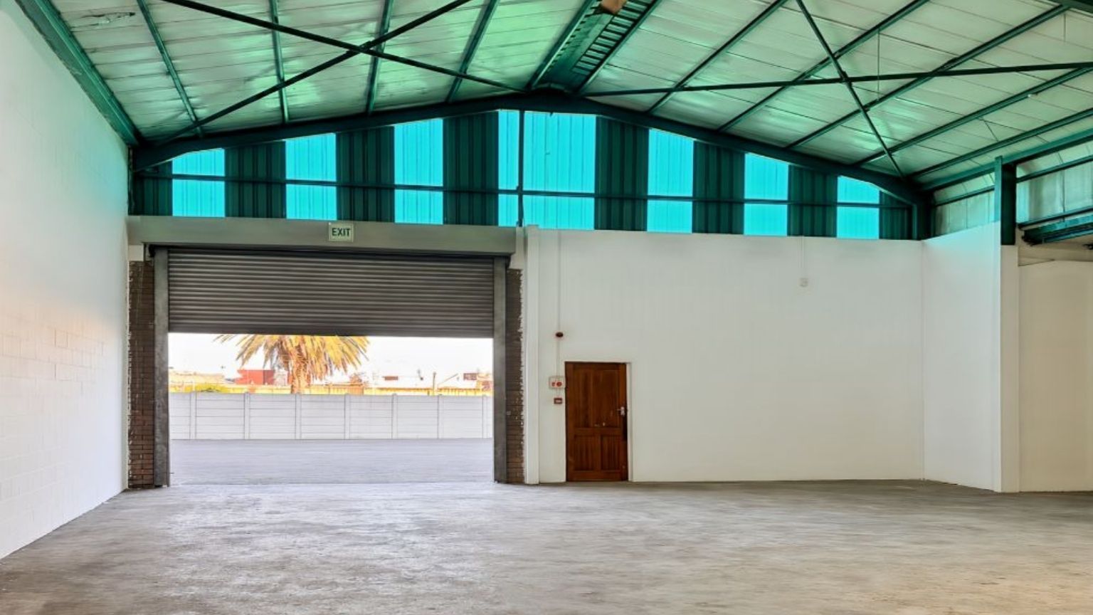Secure warehouse with roller shutter door and truck access