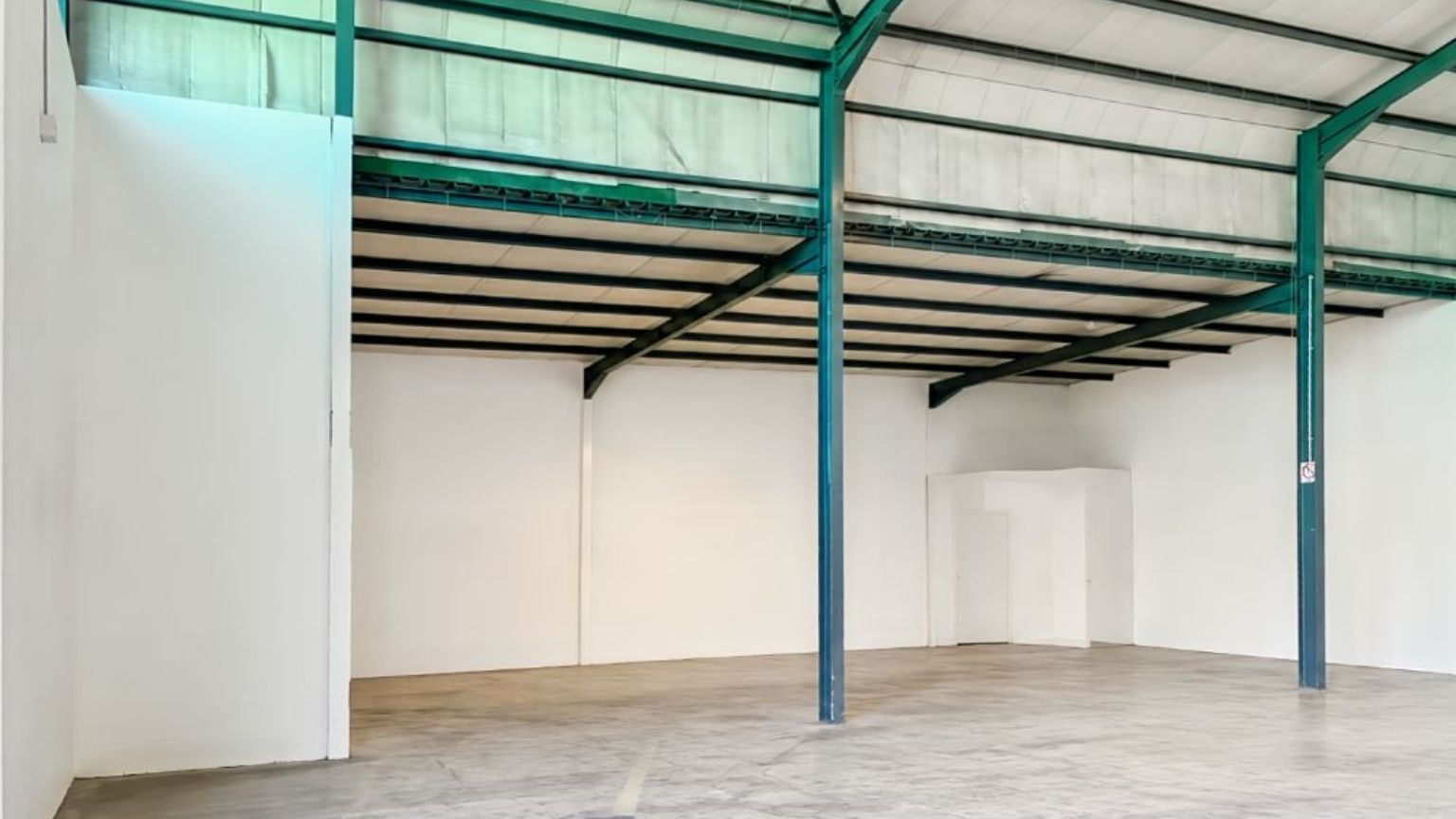Secure warehouse with roller shutter door and truck access