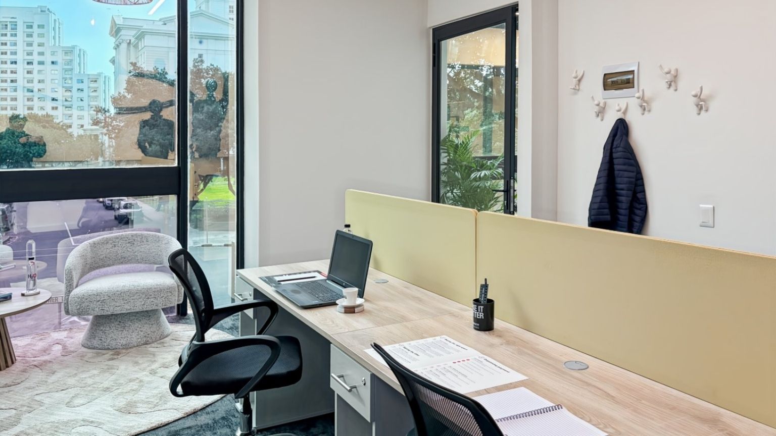 Corner loft office with high ceiling and city views