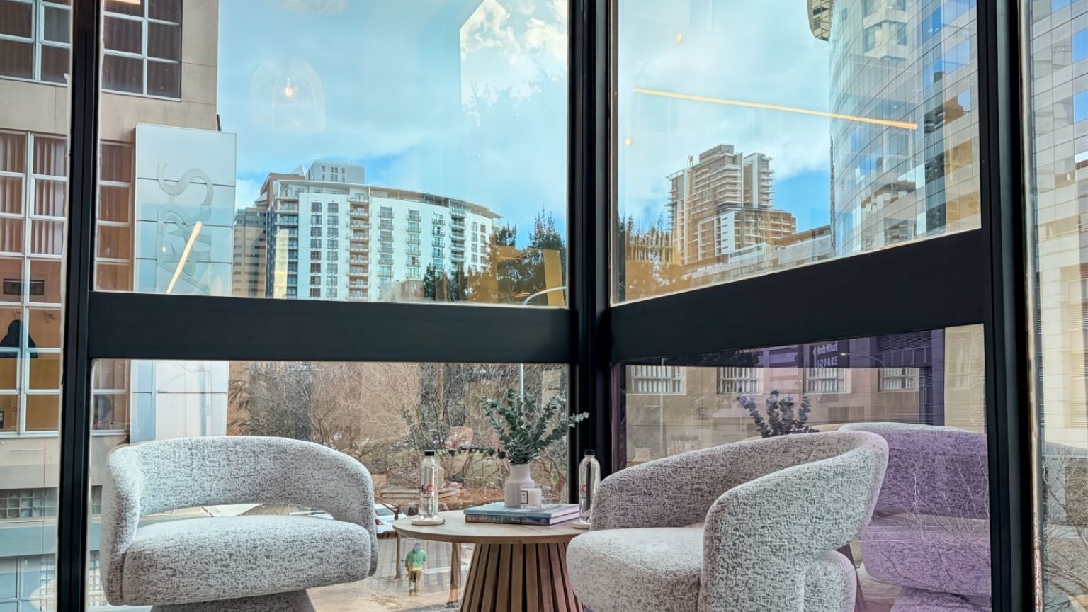 Corner loft office with high ceiling and city views