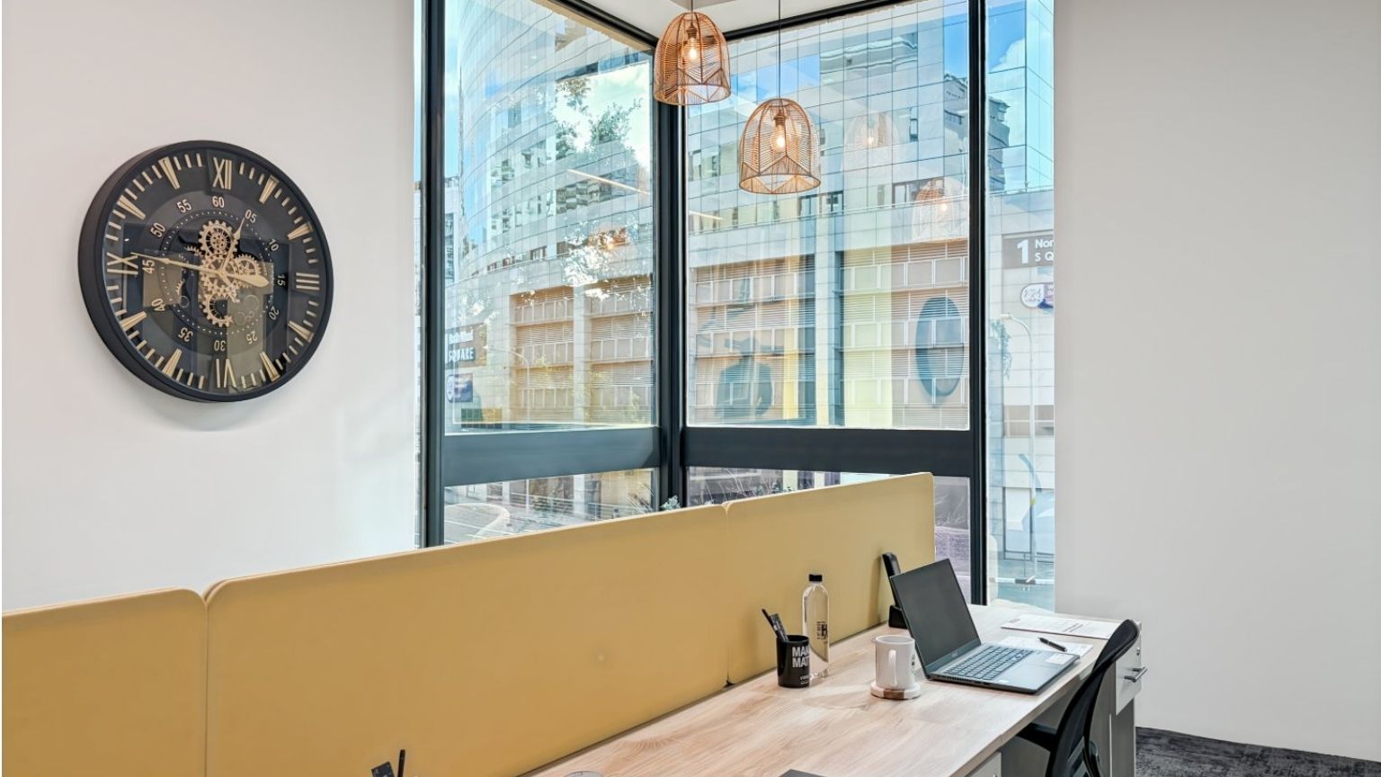 Corner loft office with high ceiling and city views