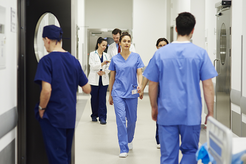 Float pool nurses in busy hospital hallway