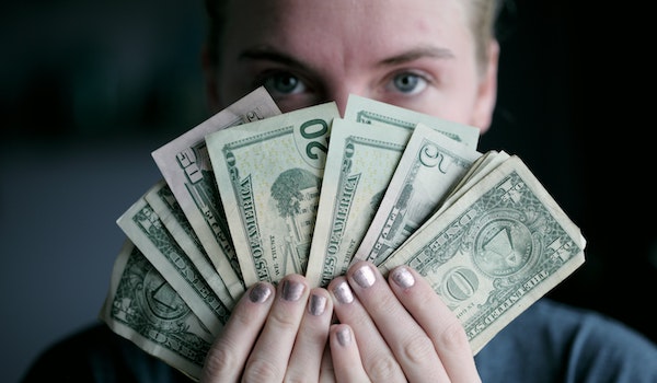 healthcare leader considering how much does new technology costs and holding money