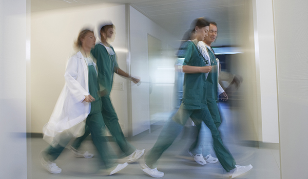 CareRev nurses rushing in the hallway