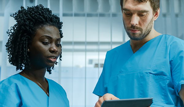 nurses looking at tablet