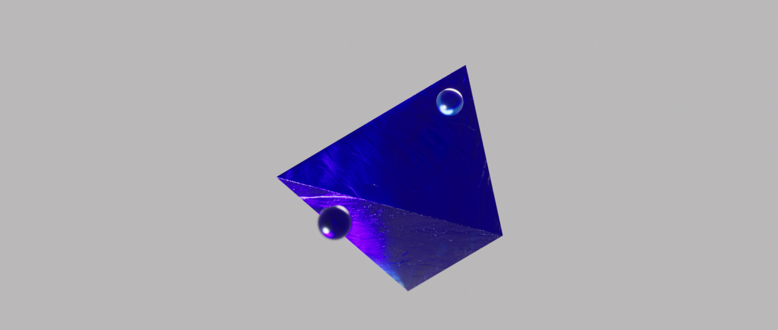 Floating spheres surrounding a pyramid in a crystal blue material in 3D for the Blauw Films Image Value Checker.