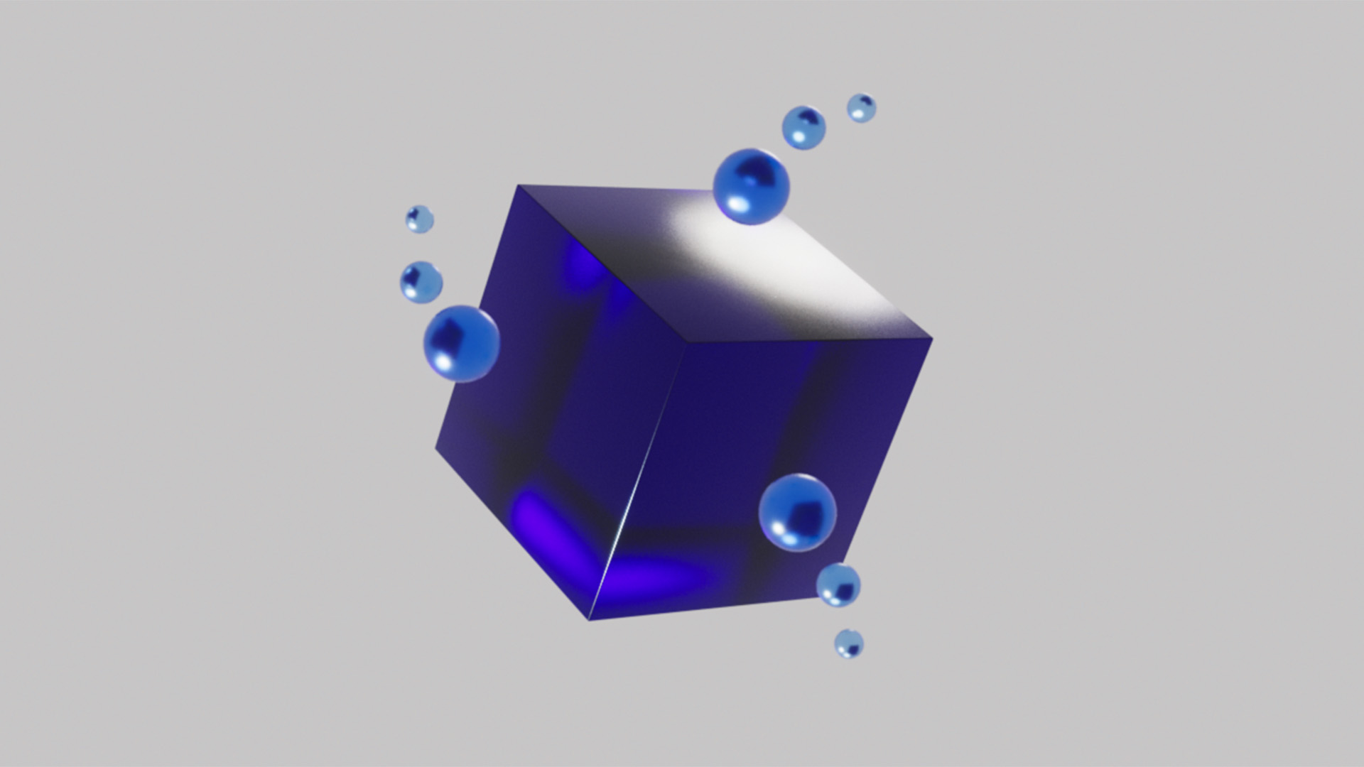 Floating spheres surrounding a cube in a crystal blue material in 3D for the Blauw Films Reading Time Calculator.