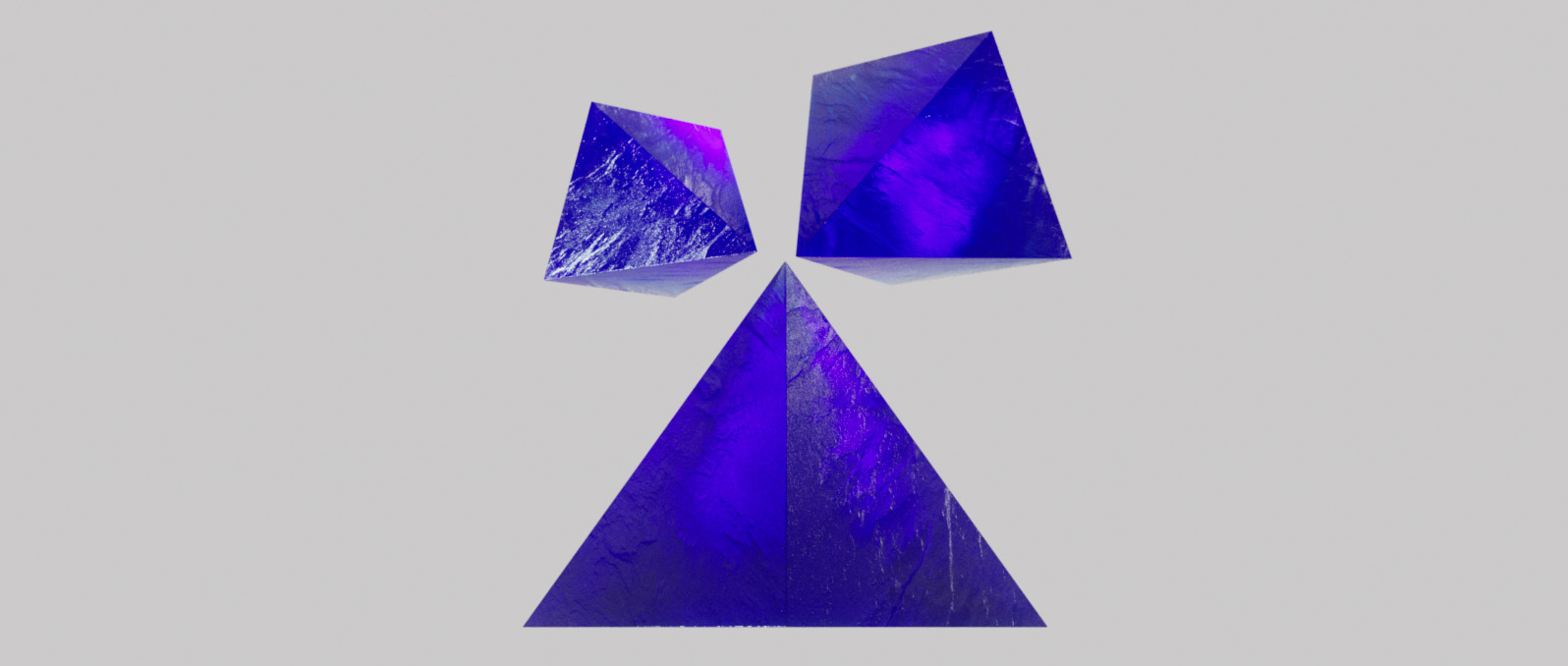 A group of 3D crystal pyramids floating in a gray background for the Blauw Films Pixel, ASCII & Dither Art Generator.
