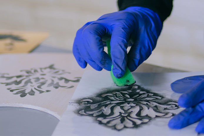 Using a stencil to put a design on a door
