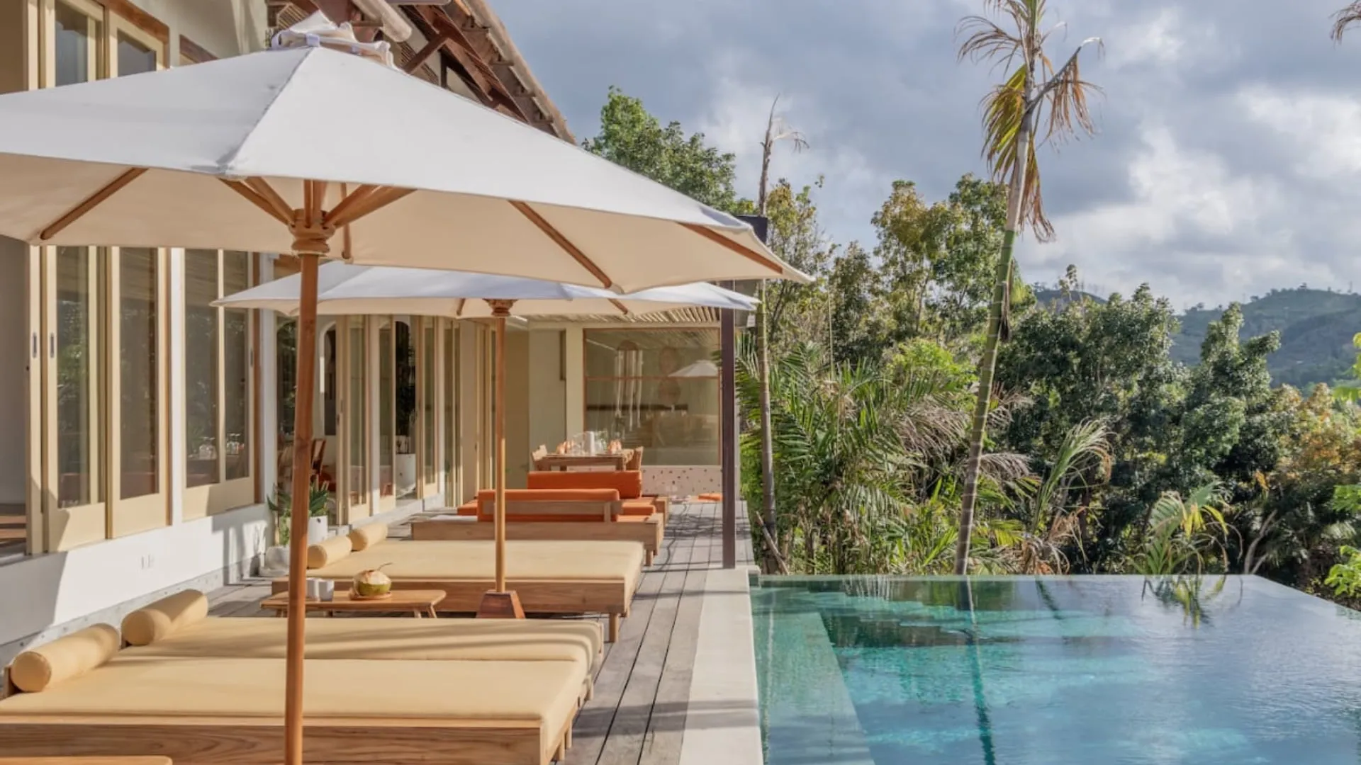 beginner riding a wave and throwing a shaka