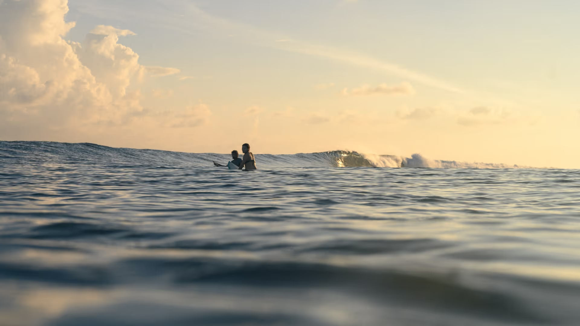 Sunrise in the lineup, just two surfers and a perfect wave