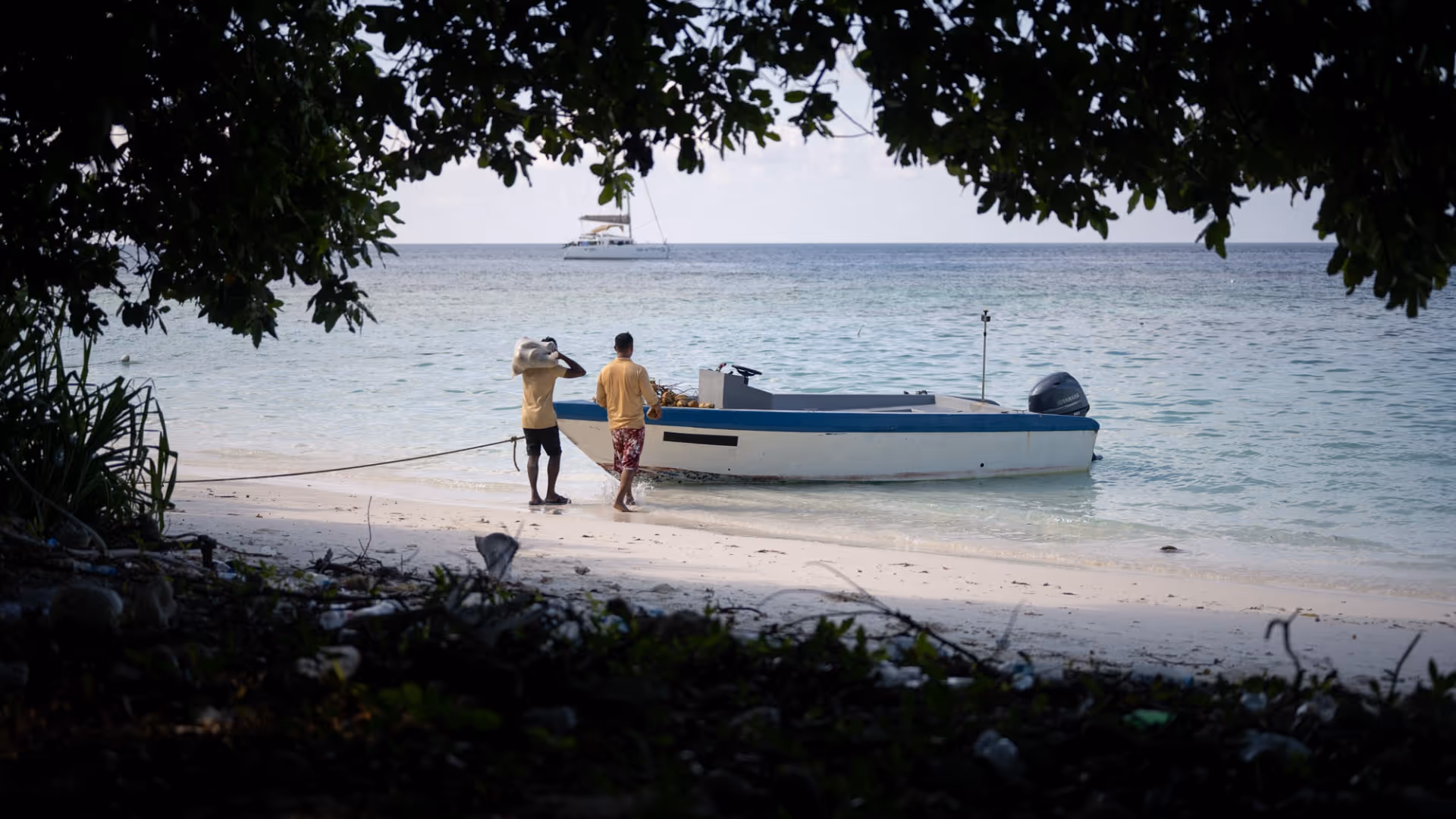Crew loading coconuts on the dinghy