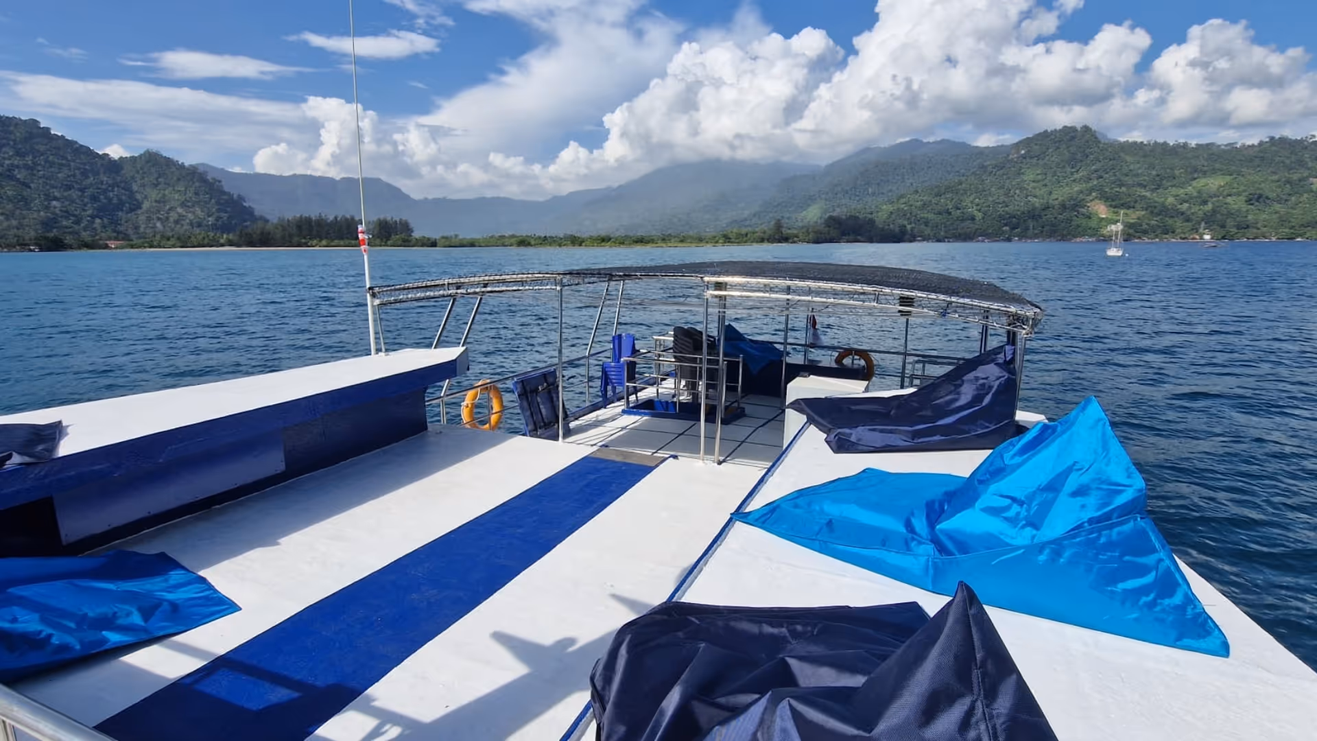 boat deck from above with ocean and island view
