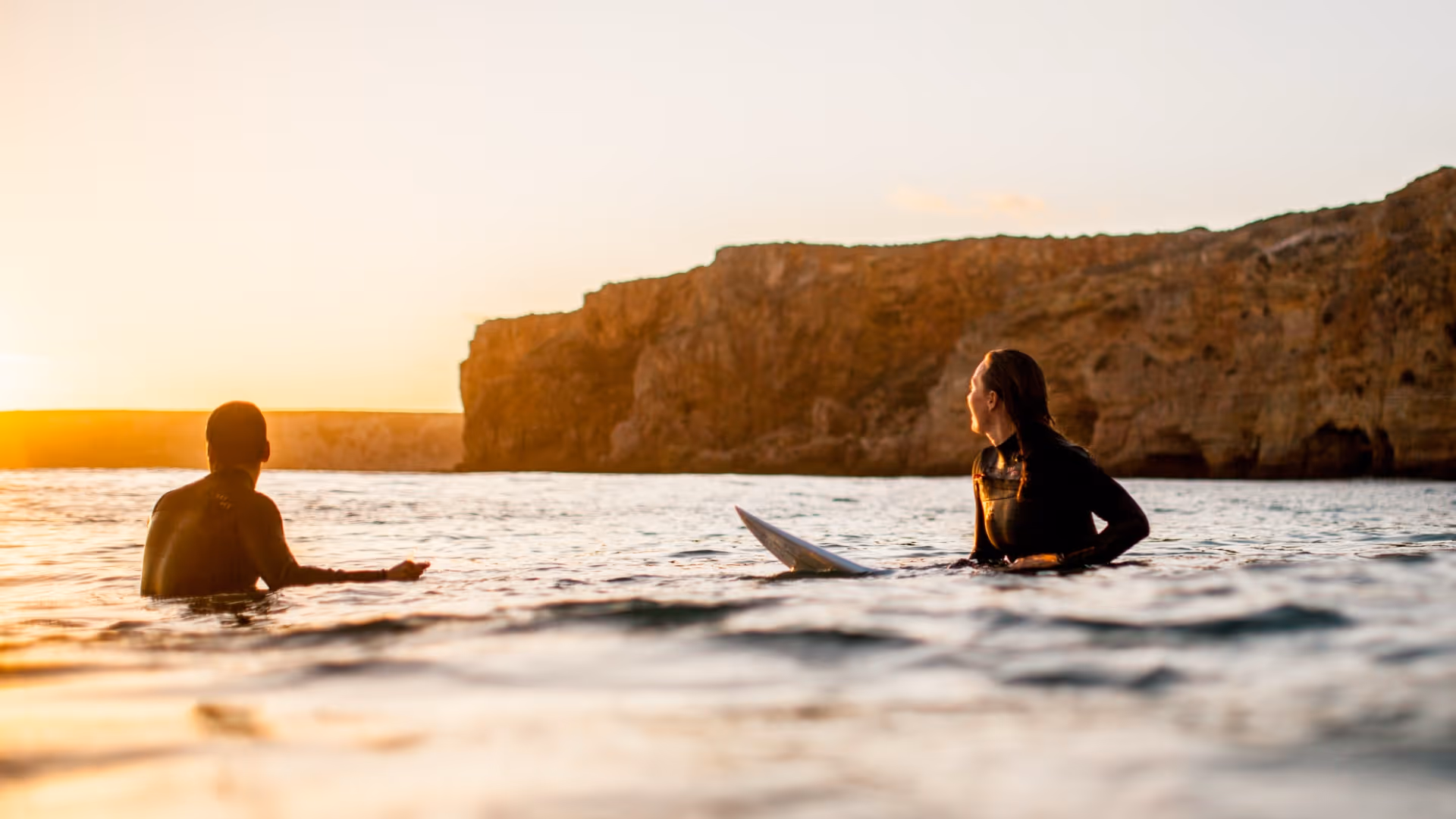 surf teacher with students
