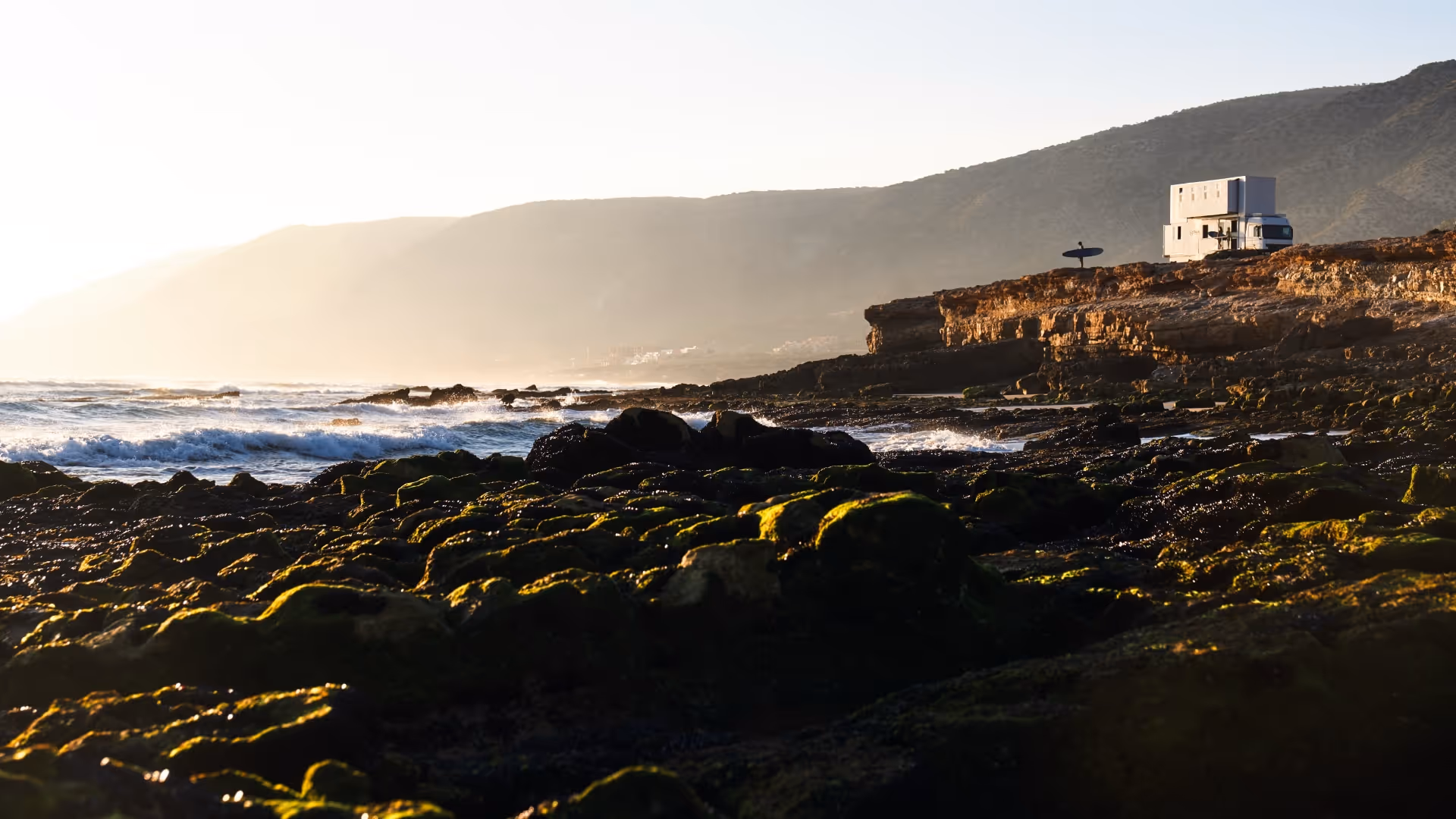 surf truck parked and surfers