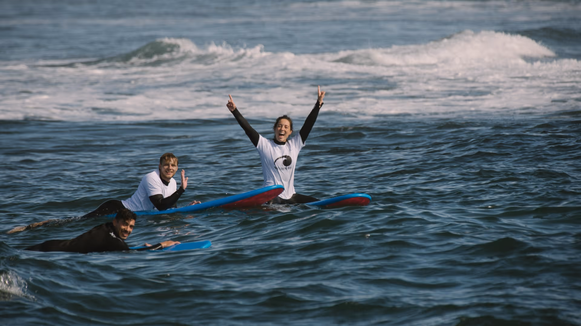 stoked surfers in the water