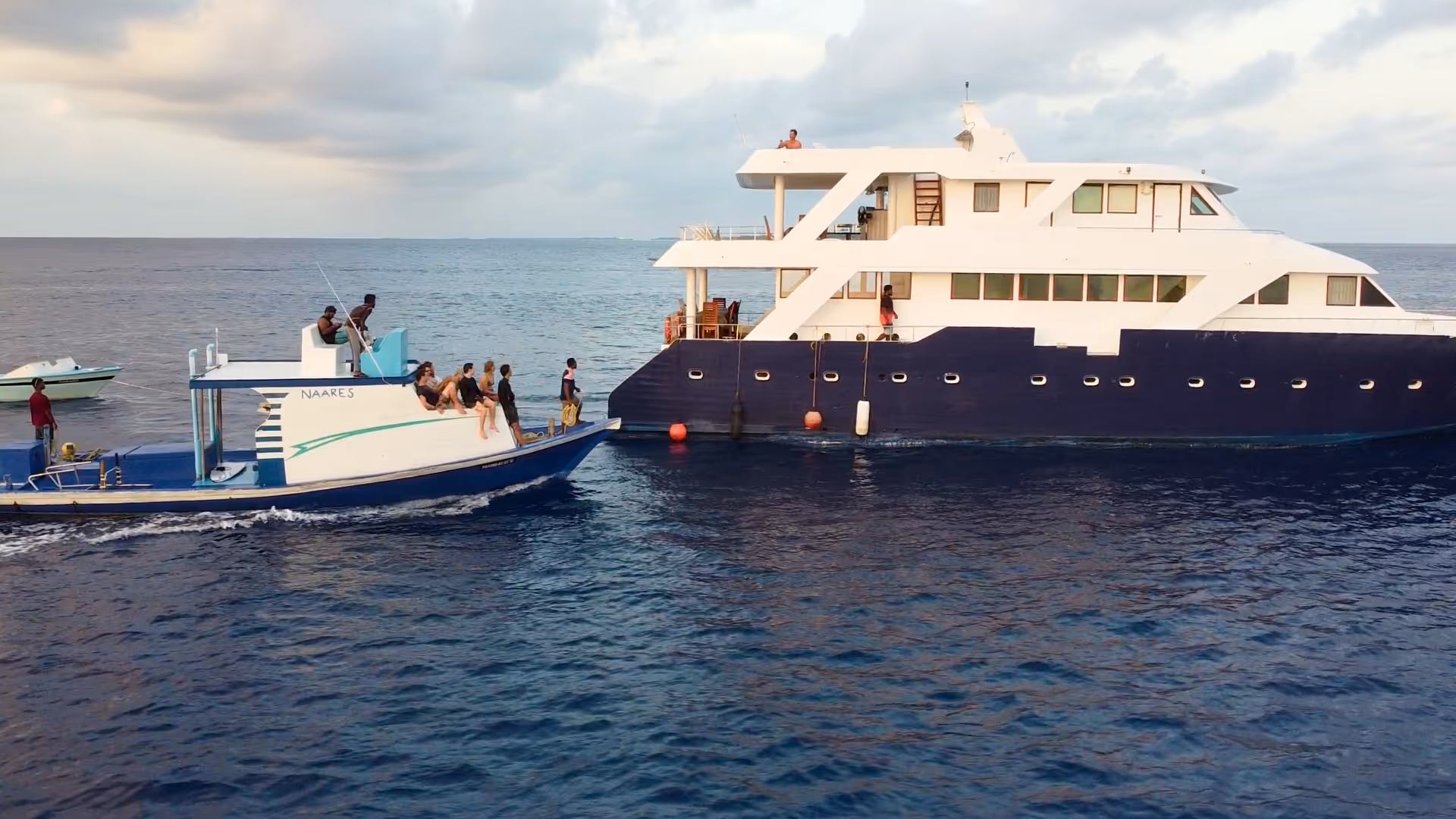 View of the boat from above with people floating