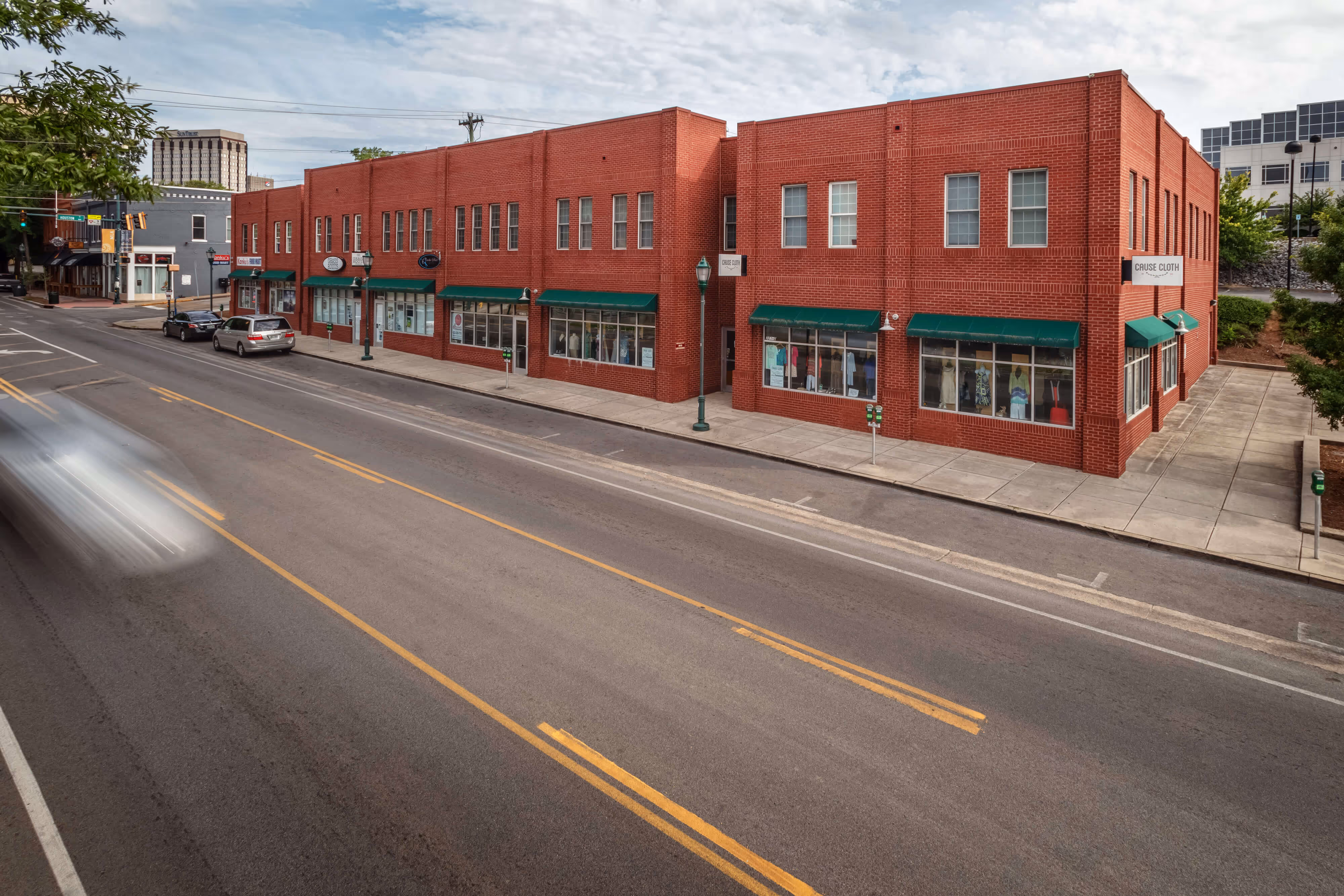 A long shot of the MLK building designed by architect David Barlew. The shot was taken with a slow shutter speed so that cars driving in front of the building look like blurs.