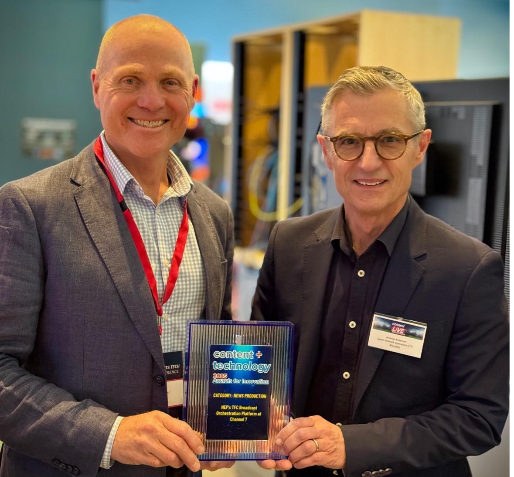 A couple of men holding a plaqueAI-generated content may be incorrect.