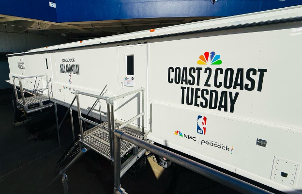 A white trailer with black writingAI-generated content may be incorrect.