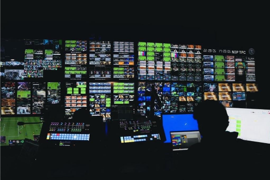 A group of people working on a computerAI-generated content may be incorrect.