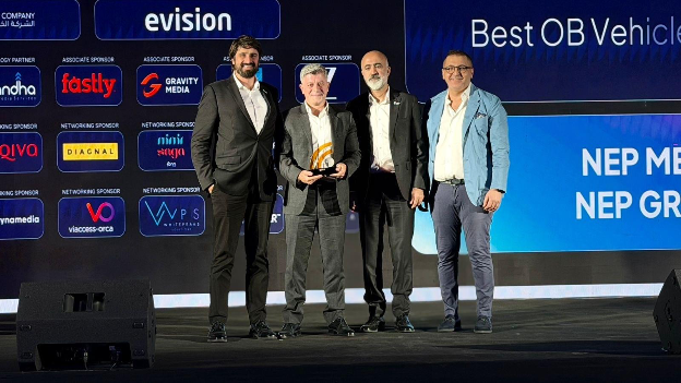 A group of men standing on a stageAI-generated content may be incorrect.