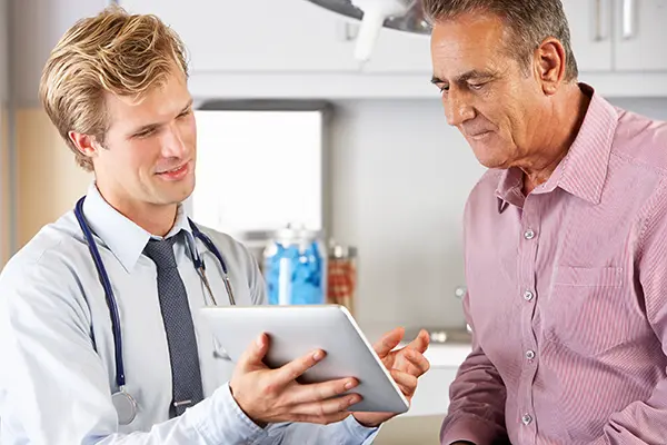 Doctor discusses BPH symptoms and treatment with his patient