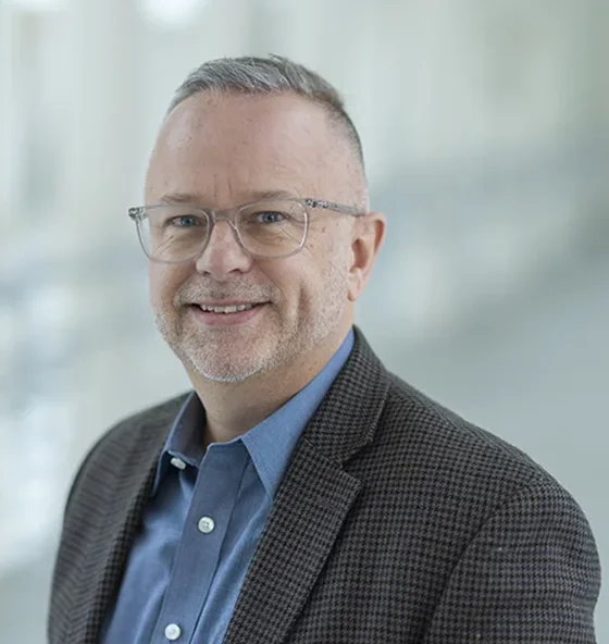 Professional headshot of Mike App.