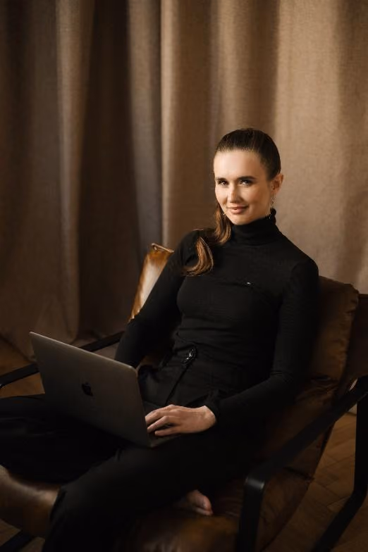 A person sitting in a chair with a computerAI-generated content may be incorrect.