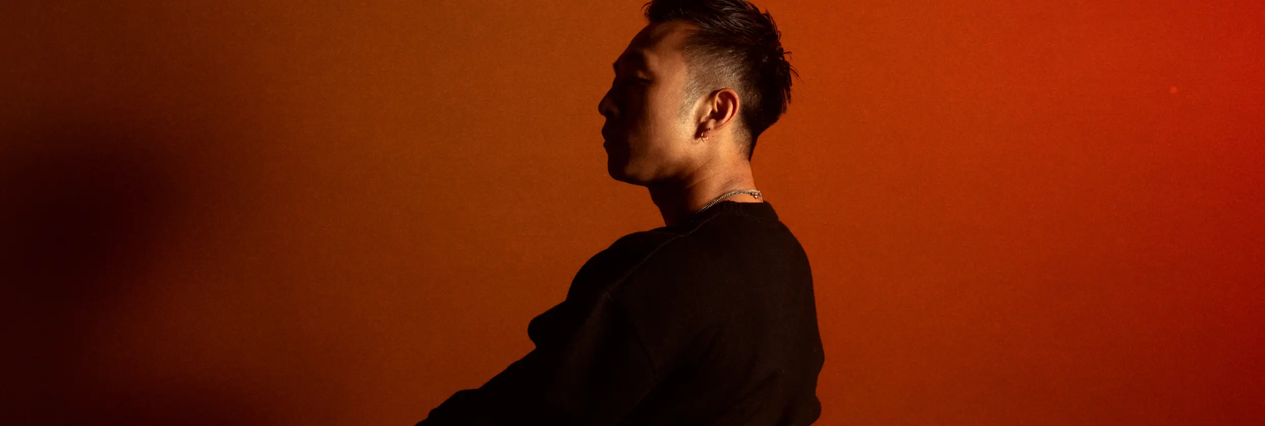 A person looking off screen with the text Musicbed overlaid