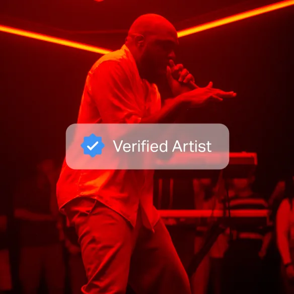 Image of an artist performing on stage with a graphic overlayed that says Verified Artist