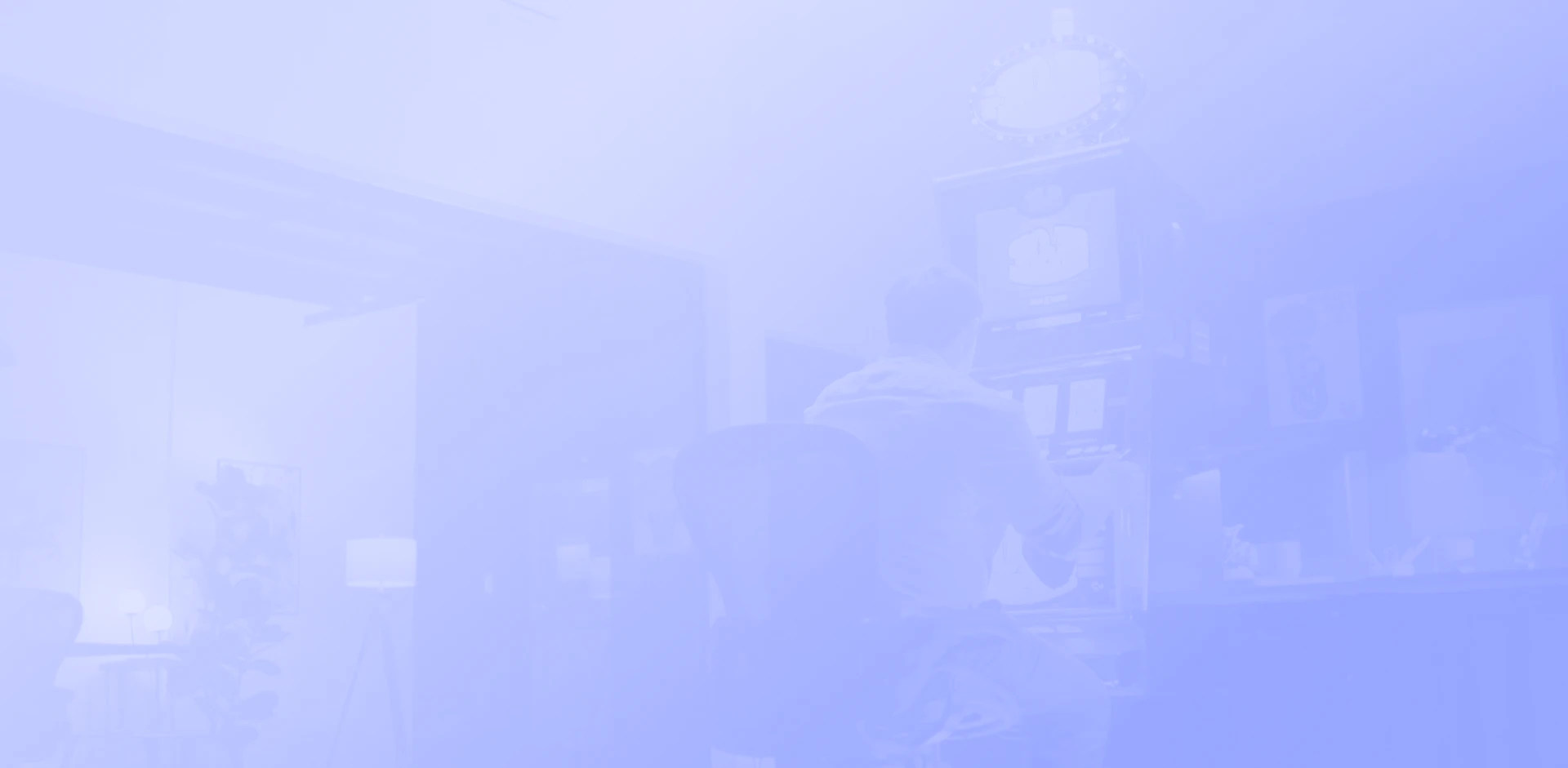 Faded image of a person working at a desk