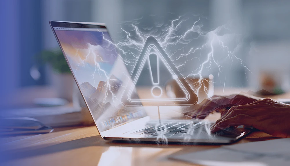 Image of hands typing on laptop