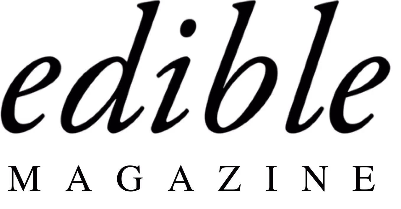 Logo of the word 'edible' written in elegant italic lowercase letters with a dot above the i.