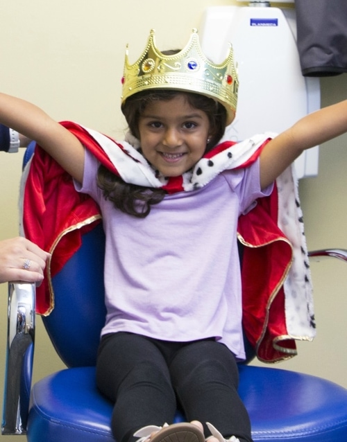 little girl with crown on her head