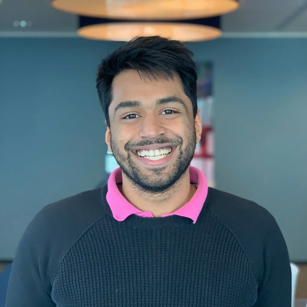 Photo of Karthik Mahadevan joyfully smiling for the camera