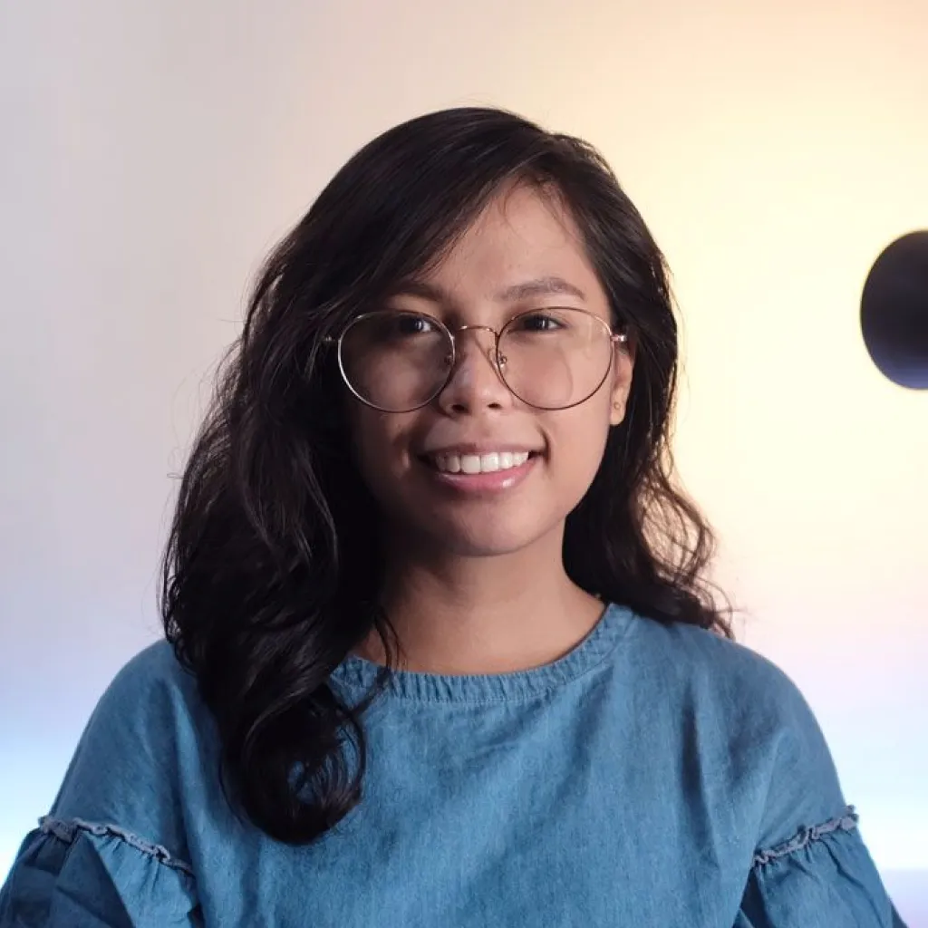 Photo of Abby happily smiling for the camera